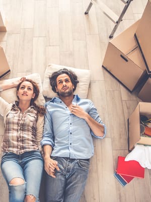 A couple moving out of their house representing rv travel trends 2026